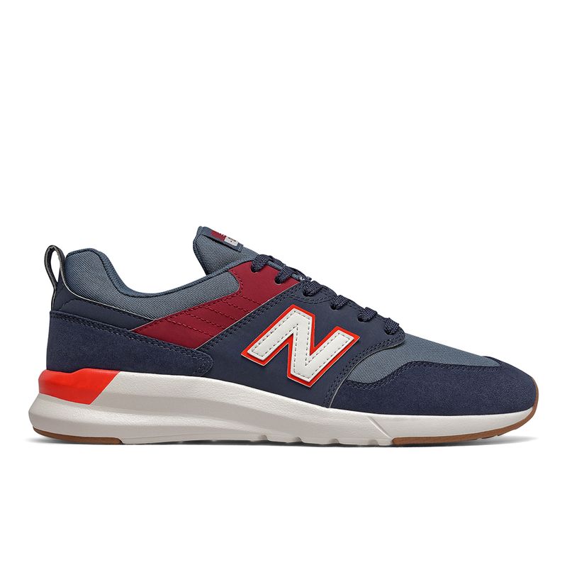 tenis new balance masculino azul e vermelho